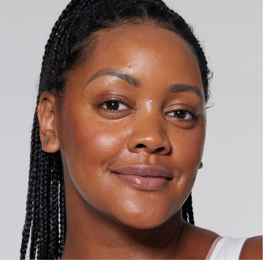 Smiling woman with radiant skin after HydraFacial treatment