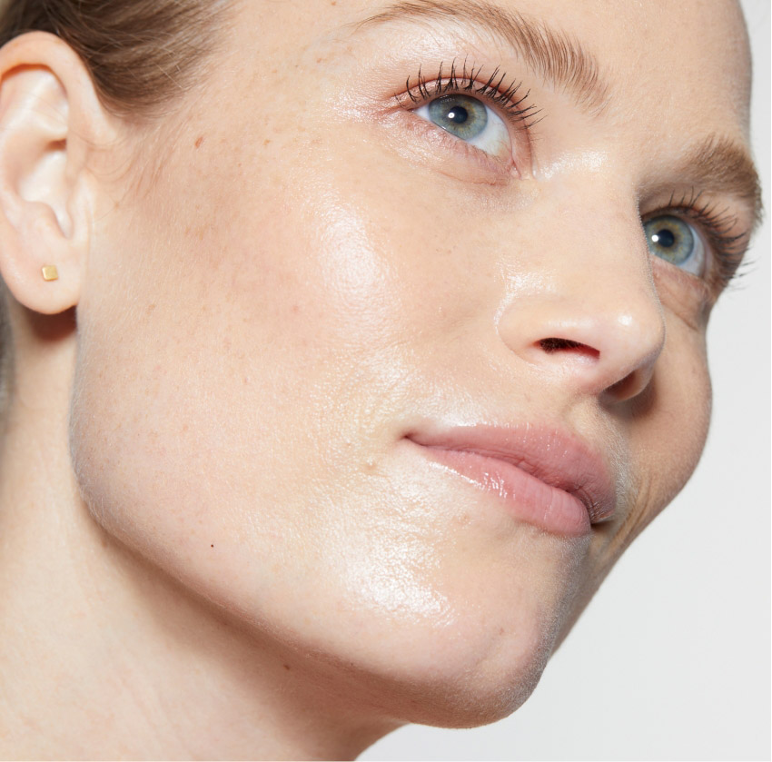 Close-up of a woman's glowing skin after HydraFacial treatment